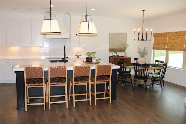 688 Harmony Rd, Temple, GA 30179 - dining space with dark wood-style flooring, a chandelier, and recessed lighting