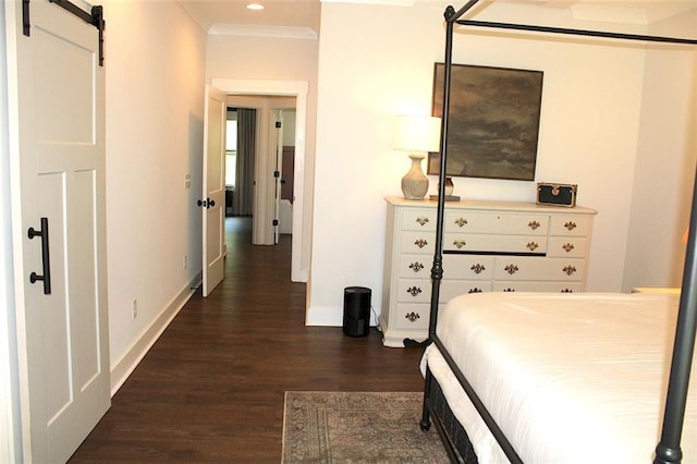 688 Harmony Rd, Temple, GA 30179 - bedroom featuring dark wood finished floors, a barn door, recessed lighting, and ornamental molding
