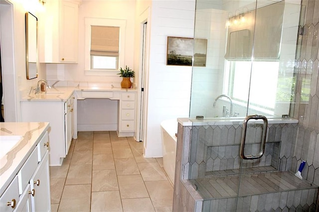 688 Harmony Rd, Temple, GA 30179 - full bathroom with two vanities, a tub to relax in, a shower stall, and tile patterned floors