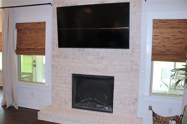 688 Harmony Rd, Temple, GA 30179 - detailed view of wood finished floors and a fireplace
