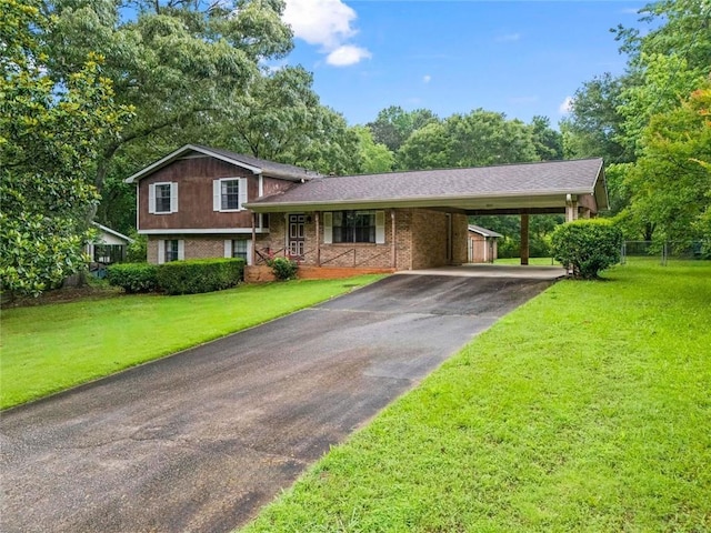 140 Carriage Cir, Stockbridge, GA 30281 - split level home with asphalt driveway, an attached carport, and covered porch