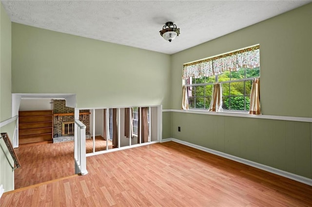 140 Carriage Cir, Stockbridge, GA 30281 - unfurnished room with wood finished floors, stairway, and a textured ceiling