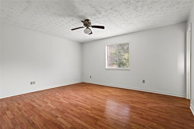 140 Carriage Cir, Stockbridge, GA 30281 - spare room with wood finished floors, ceiling fan, and a textured ceiling