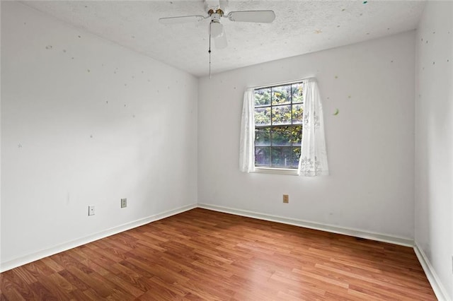 140 Carriage Cir, Stockbridge, GA 30281 - unfurnished room featuring light wood-style flooring, a ceiling fan, and a textured ceiling