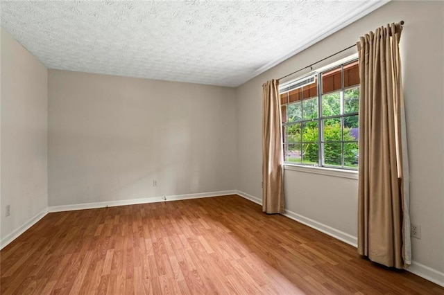 140 Carriage Cir, Stockbridge, GA 30281 - unfurnished room featuring wood finished floors and a textured ceiling