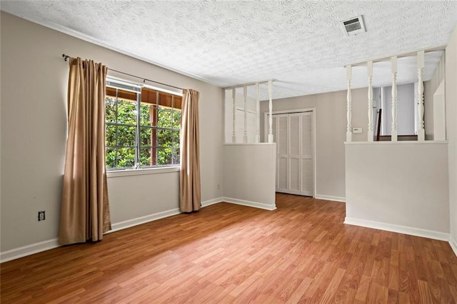 140 Carriage Cir, Stockbridge, GA 30281 - unfurnished room with wood finished floors and a textured ceiling