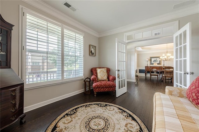 5515 Cheatam Ave, Cumming, GA 30040 - sitting room with french doors, plenty of natural light, crown molding, wood finished floors, and a chandelier