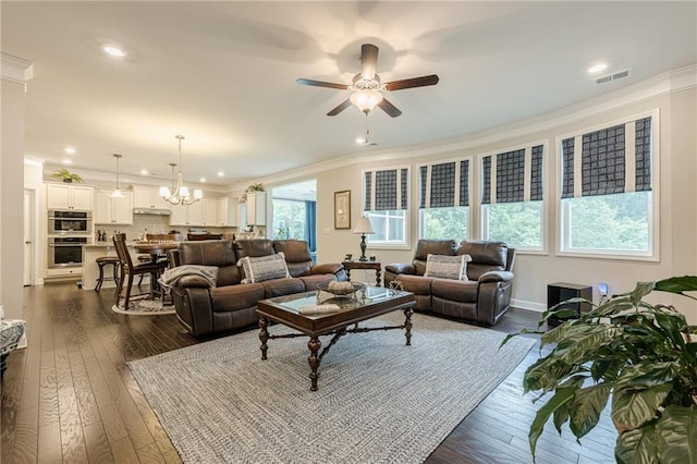 5515 Cheatam Ave, Cumming, GA 30040 - living area with crown molding, a ceiling fan, a chandelier, dark wood finished floors, and recessed lighting