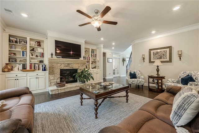 5515 Cheatam Ave, Cumming, GA 30040 - living area featuring a ceiling fan, ornamental molding, a stone fireplace, dark wood-style flooring, and recessed lighting