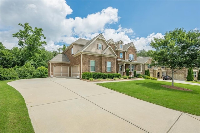 5515 Cheatam Ave, Cumming, GA 30040 - craftsman-style house featuring brick siding, a front lawn, concrete driveway, and a garage