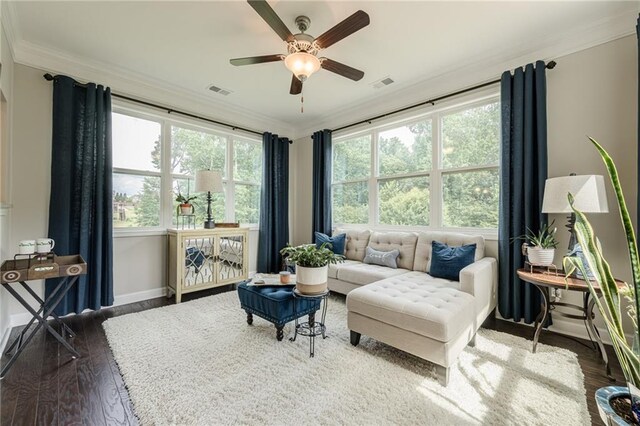 5515 Cheatam Ave, Cumming, GA 30040 - living area featuring ornamental molding, healthy amount of natural light, wood finished floors, and a ceiling fan