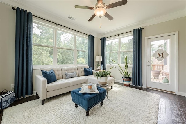5515 Cheatam Ave, Cumming, GA 30040 - living room with crown molding, healthy amount of natural light, wood finished floors, and ceiling fan