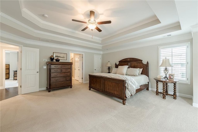 5515 Cheatam Ave, Cumming, GA 30040 - bedroom featuring a raised ceiling, light carpet, crown molding, ensuite bathroom, and a ceiling fan