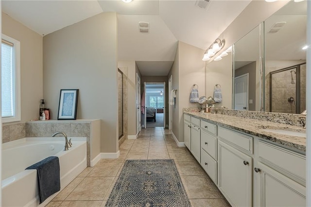 5515 Cheatam Ave, Cumming, GA 30040 - full bathroom with a garden tub, double vanity, a shower stall, lofted ceiling, and tile patterned floors