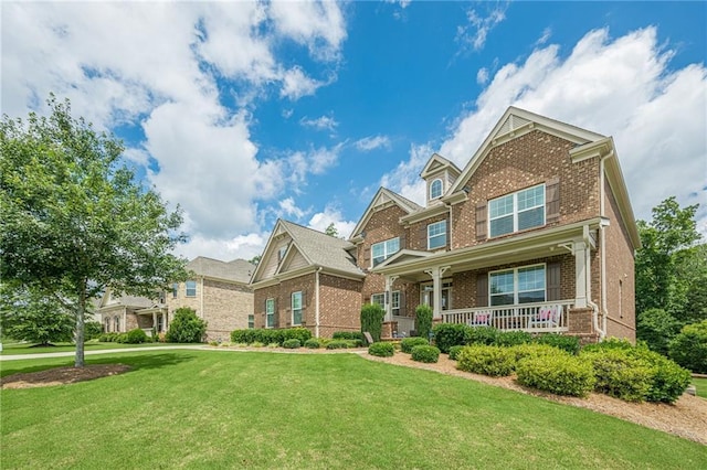 5515 Cheatam Ave, Cumming, GA 30040 - craftsman-style home featuring brick siding, a porch, and a front lawn