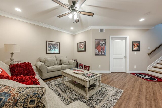 5515 Cheatam Ave, Cumming, GA 30040 - living area with a ceiling fan, wood finished floors, stairway, recessed lighting, and crown molding