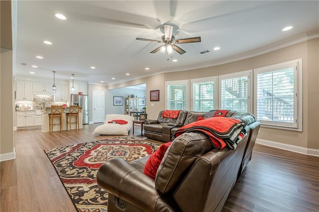 5515 Cheatam Ave, Cumming, GA 30040 - living area with ceiling fan, crown molding, wood finished floors, and recessed lighting