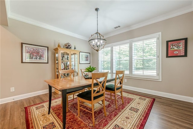 5515 Cheatam Ave, Cumming, GA 30040 - dining area with a chandelier, wood finished floors, and ornamental molding