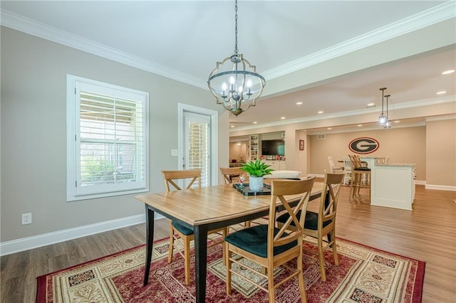5515 Cheatam Ave, Cumming, GA 30040 - dining area with light wood-type flooring, ornamental molding, a chandelier, and recessed lighting