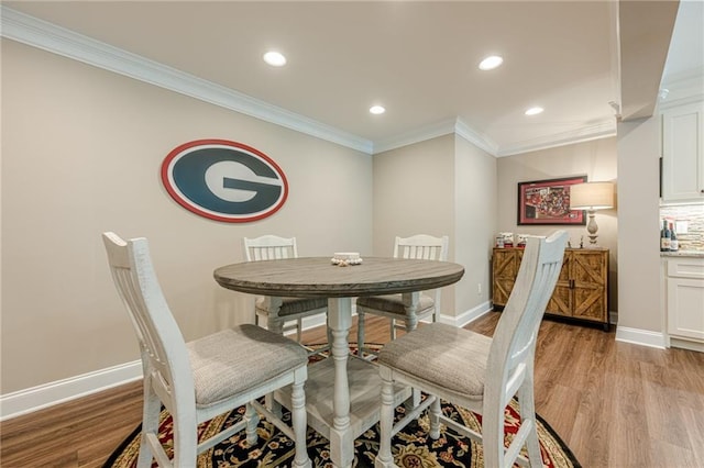 5515 Cheatam Ave, Cumming, GA 30040 - dining area featuring ornamental molding, light wood finished floors, and recessed lighting