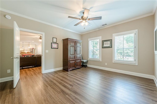 5515 Cheatam Ave, Cumming, GA 30040 - spare room with ceiling fan, wood finished floors, crown molding, and a smoke detector