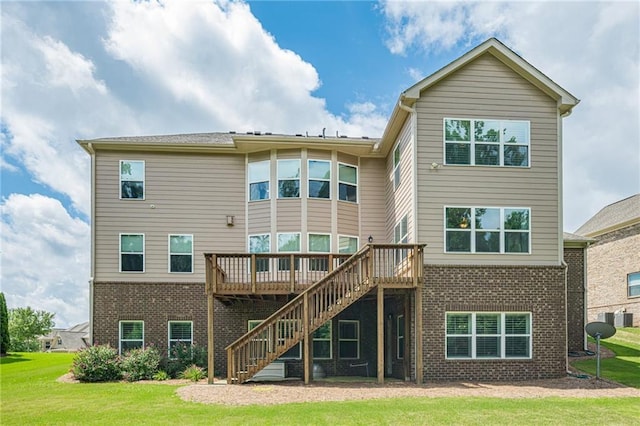 5515 Cheatam Ave, Cumming, GA 30040 - rear view of property featuring brick siding, stairs, a wooden deck, and a yard