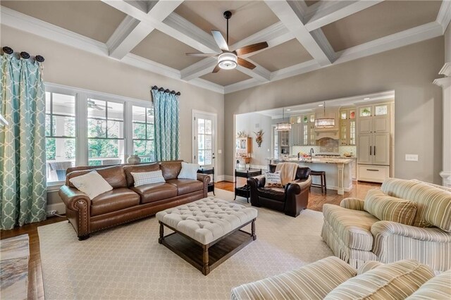 341 Carl Sanders Dr, Acworth, GA 30101 - living area featuring ceiling fan, coffered ceiling, beamed ceiling, and light wood-type flooring