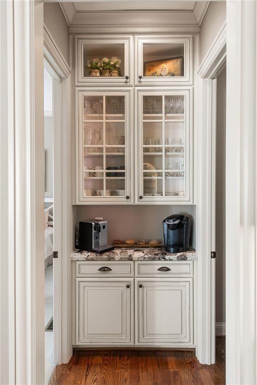 341 Carl Sanders Dr, Acworth, GA 30101 - bar area featuring crown molding and dark wood-type flooring