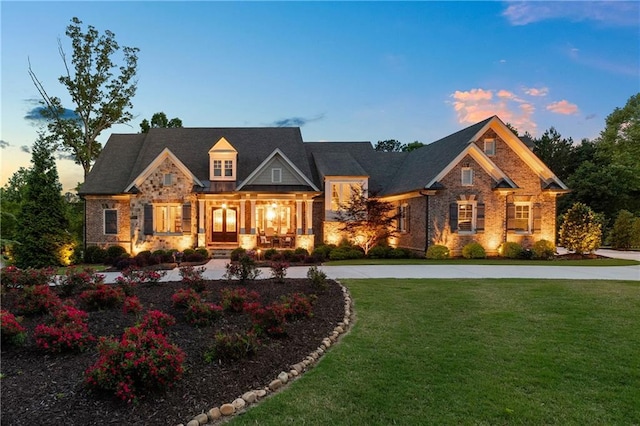 341 Carl Sanders Dr, Acworth, GA 30101 - craftsman-style home featuring stone siding, a front lawn, and a porch