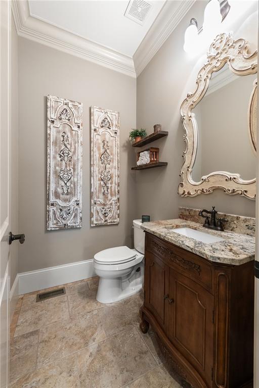 341 Carl Sanders Dr, Acworth, GA 30101 - bathroom featuring vanity and crown molding