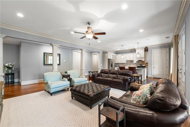 341 Carl Sanders Dr, Acworth, GA 30101 - living area with decorative columns, ceiling fan, recessed lighting, ornamental molding, and wood finished floors