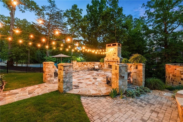 341 Carl Sanders Dr, Acworth, GA 30101 - gate featuring an outdoor stone fireplace and a patio area