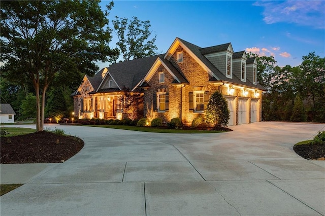 341 Carl Sanders Dr, Acworth, GA 30101 - view of front of property with curved driveway, stone siding, and an attached garage