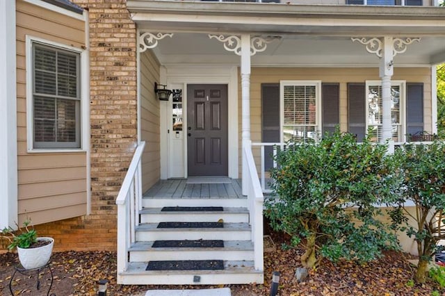 property entrance featuring covered porch