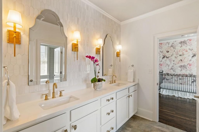 bathroom featuring ornamental molding and vanity