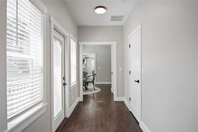 entryway with dark wood-type flooring