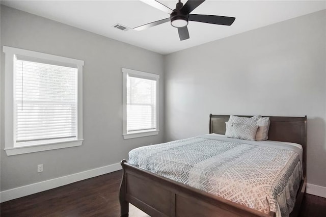 bedroom featuring dark hardwood / wood-style flooring and ceiling fan