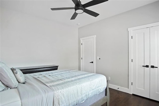 bedroom with ceiling fan and dark hardwood / wood-style flooring