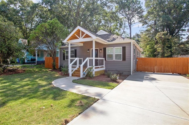 bungalow-style home featuring a front yard