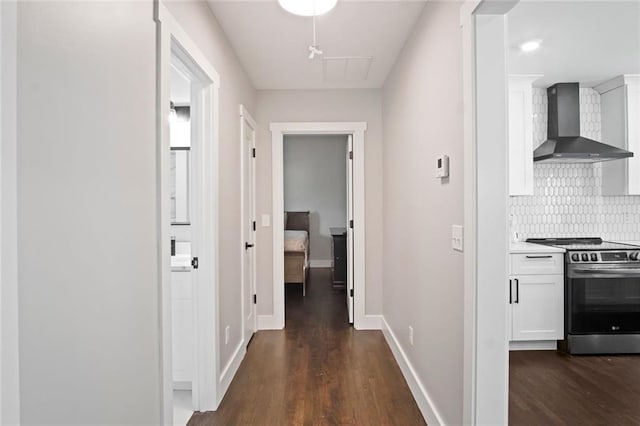 hall with dark hardwood / wood-style flooring