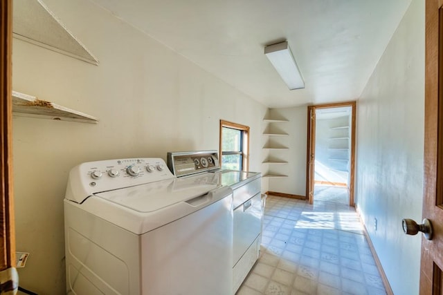 clothes washing area featuring washer and clothes dryer