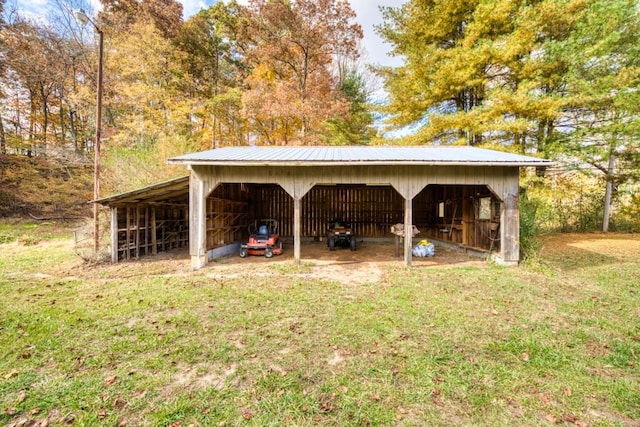 view of outbuilding featuring a yard