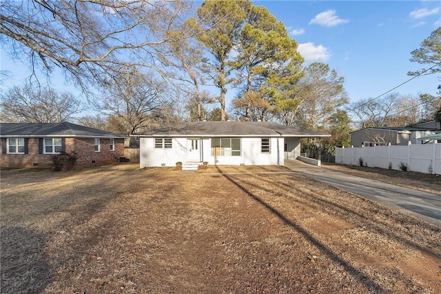 ranch-style house featuring a carport