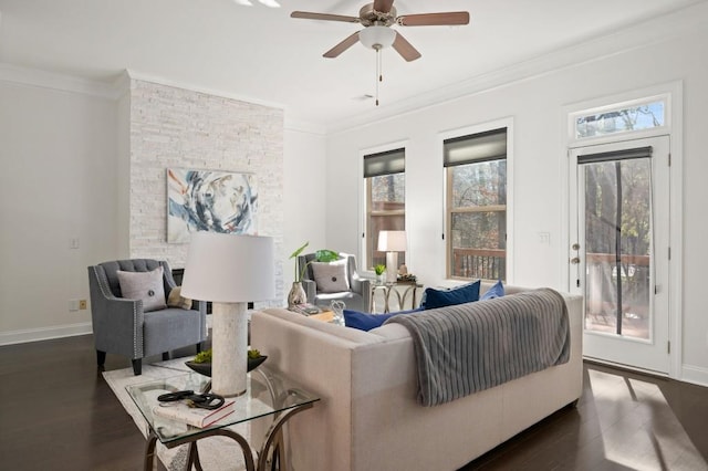 living room featuring crown molding, baseboards, and dark wood-type flooring