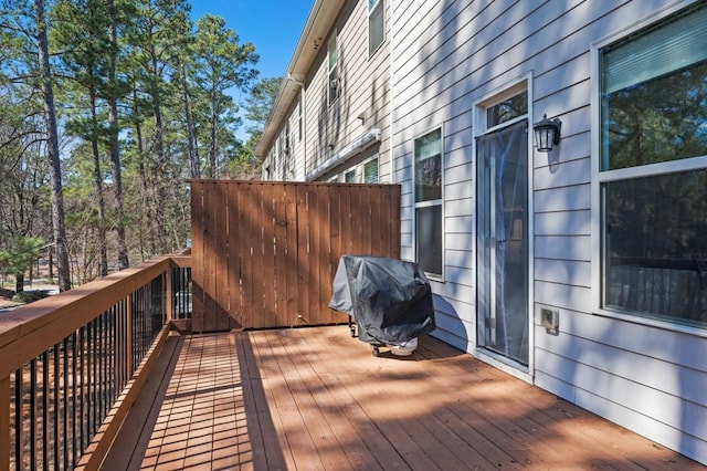 wooden deck featuring area for grilling