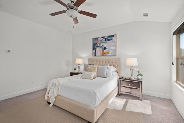 bedroom with ceiling fan, visible vents, baseboards, vaulted ceiling, and carpet