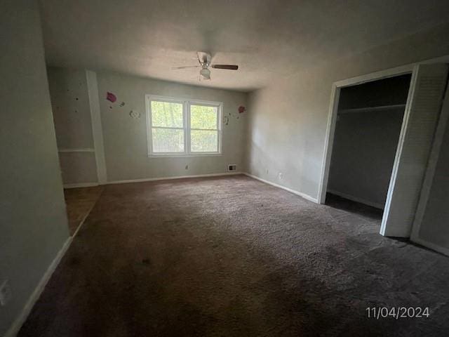 unfurnished bedroom featuring carpet and ceiling fan