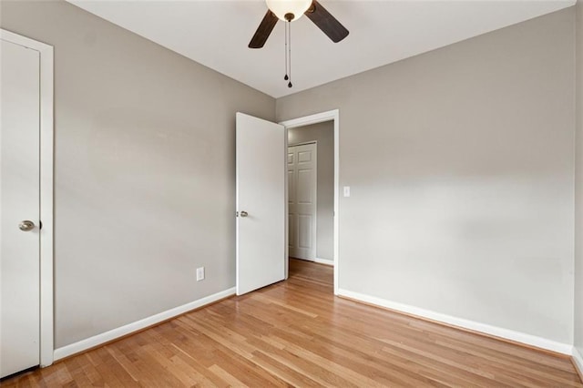 unfurnished bedroom with ceiling fan and light hardwood / wood-style flooring