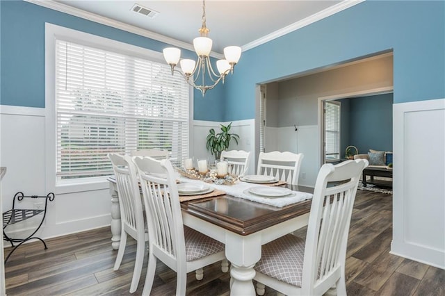 48 Violet Ln, Dallas, GA 30132 - dining area with a chandelier, a wainscoted wall, ornamental molding, and wood finished floors