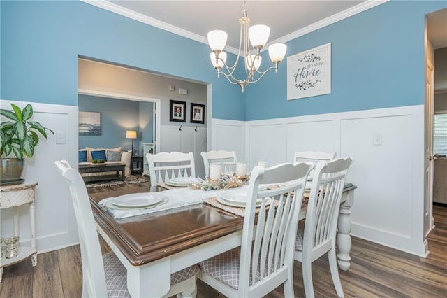 48 Violet Ln, Dallas, GA 30132 - dining room featuring a decorative wall, a chandelier, wood finished floors, crown molding, and a wainscoted wall